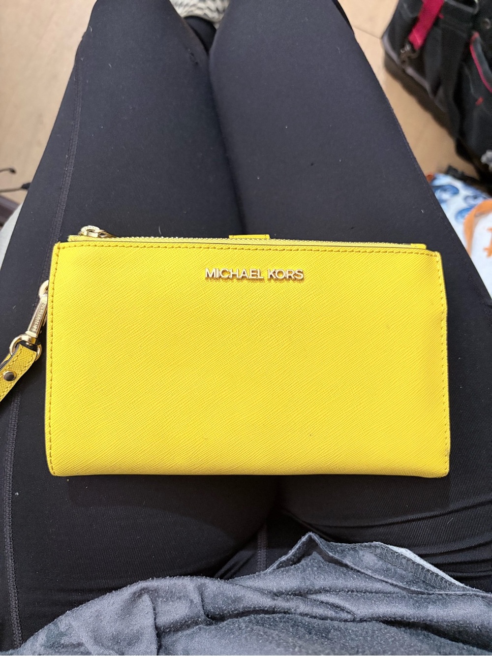 MICHAEL KORS Yellow Saffiano Wristlet Wallet with Gold Logo